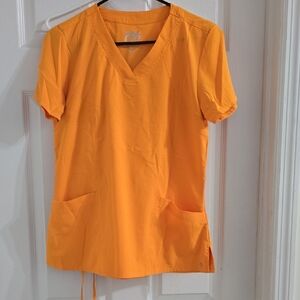 Barco Uniforms Women's Orange V-Neck Scrub Set.